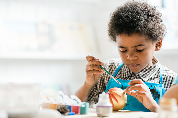 Child doing arts and crafts at a Day care Center